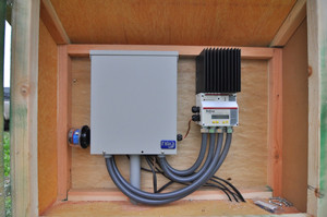 An enclosure for the charge controller and power panel, separated from the batteries.