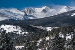 Winter view of the Continental Divide with the Mountain Research Station located in the forest belo