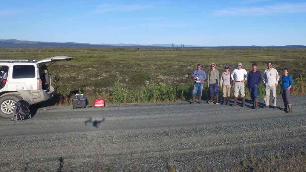 Picture of drone shadow and the NG Arctic / AmeriFlux science team in Seward Peninsula. Left to right: Sébastien Biraud, Oriana Chafe, Margaret Torn, Stan Wullschleger, Mark Conrad, Bryan Curtis, Sigrid Dengel 